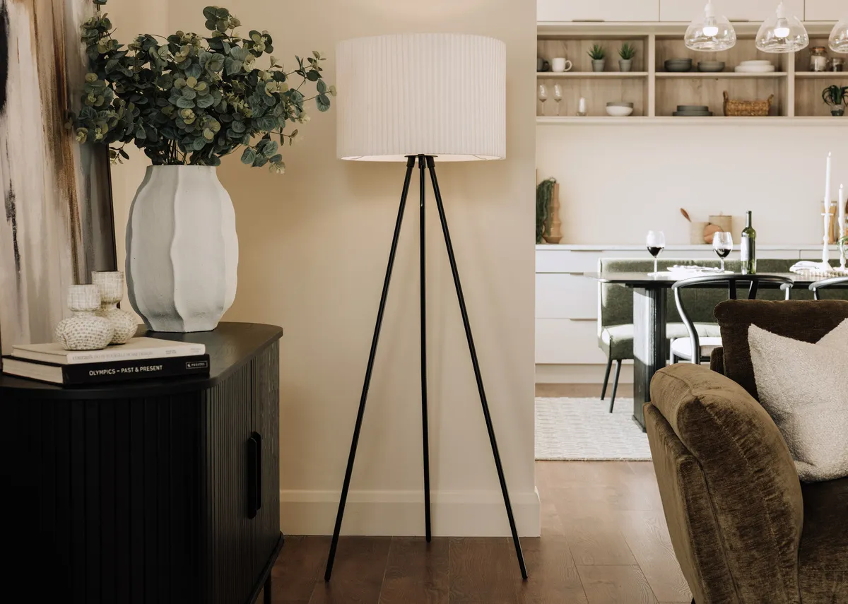 A lifetsyle image of the Starlette lamp on with Nola sideboard