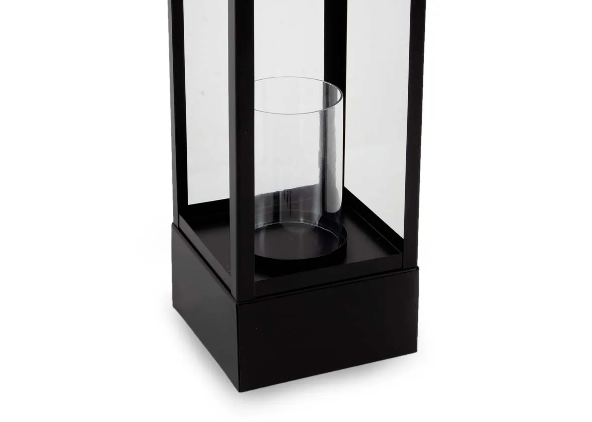A small black lantern with wood handle and glass insert from EZ Livings Candle Holder range. Closeup of base with pillar candle holder inside.