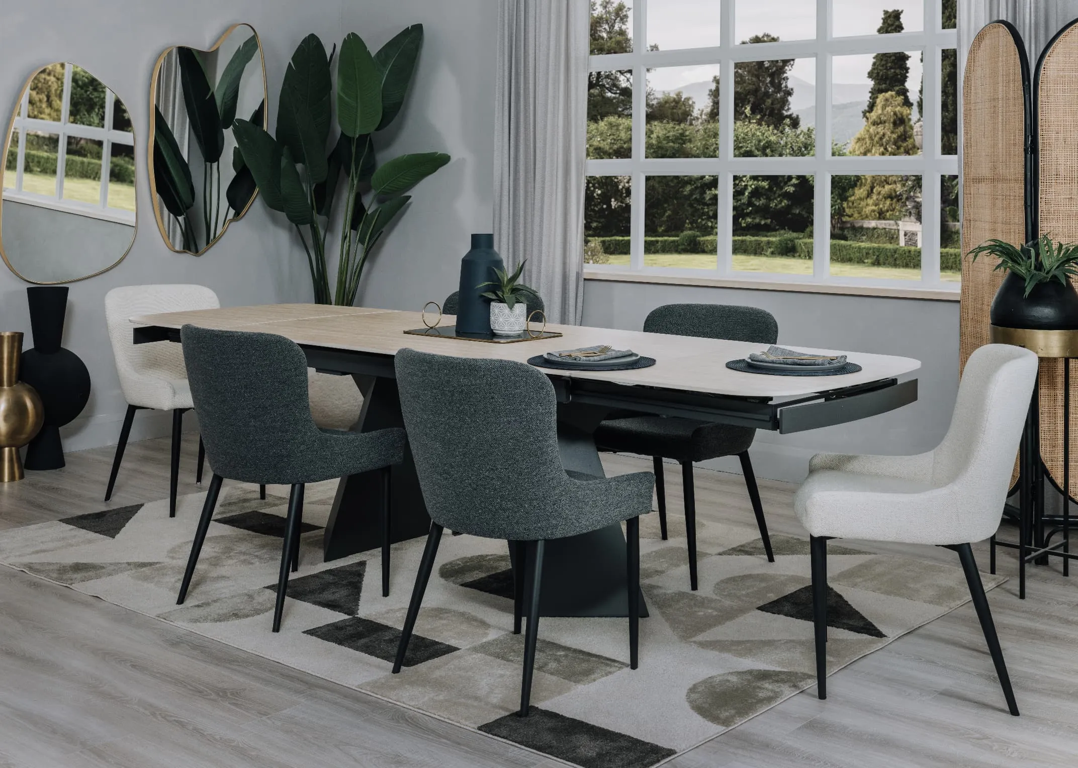 A lifestyle image of the jenna table with Ontario chairs and rectangular tray with vase on table centre with Colson mirror