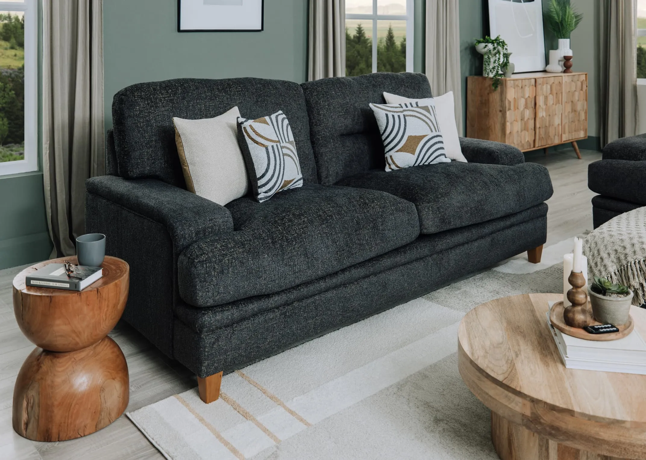 A lifesttle image of the Trieste 3 seater sofa with mooring side table and mango coffee table.