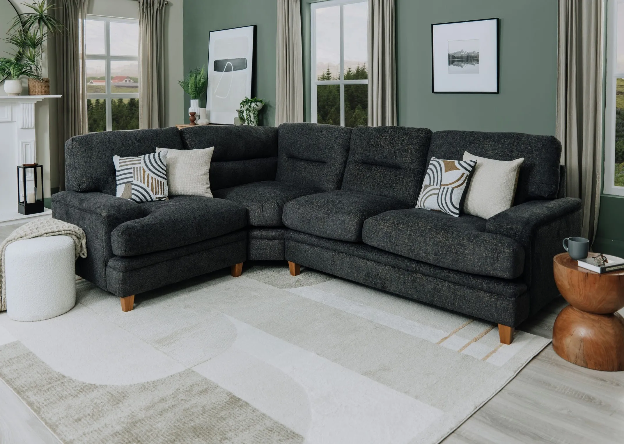 A lifestyle image of the Trieste Medium Corner sofa with Brice rug and parker footstool.