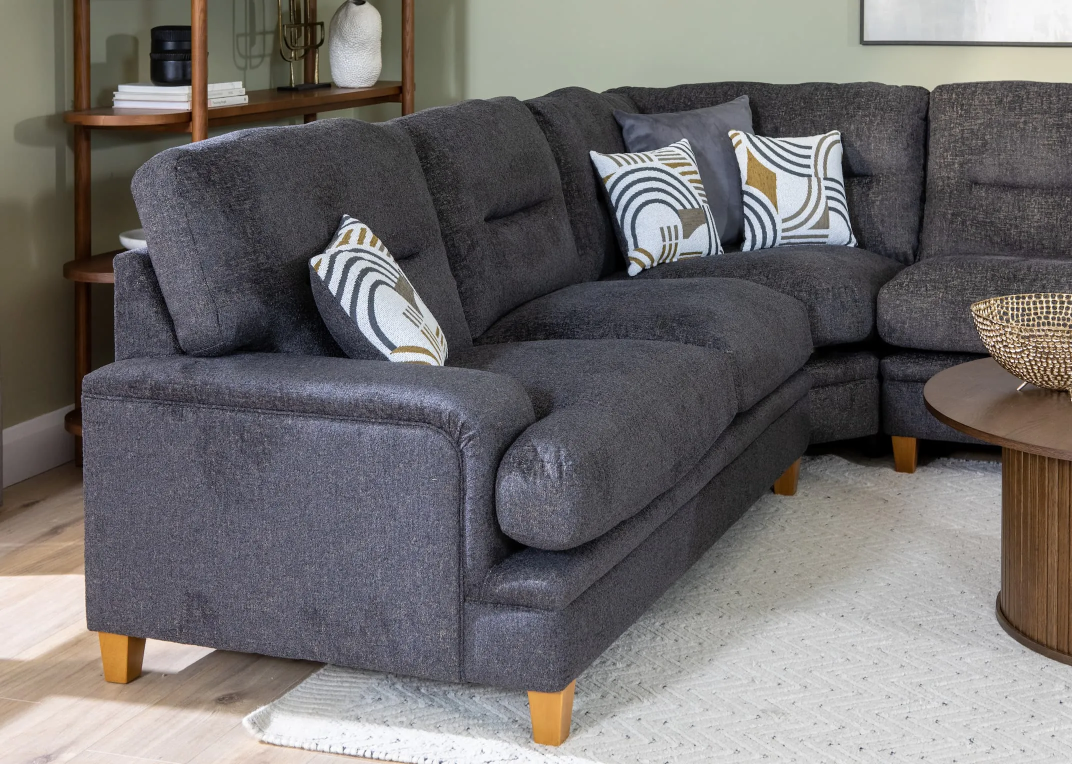 A lifestyle image of the Trieste Corner sofa with closeup detail from EZ Living Furniture.