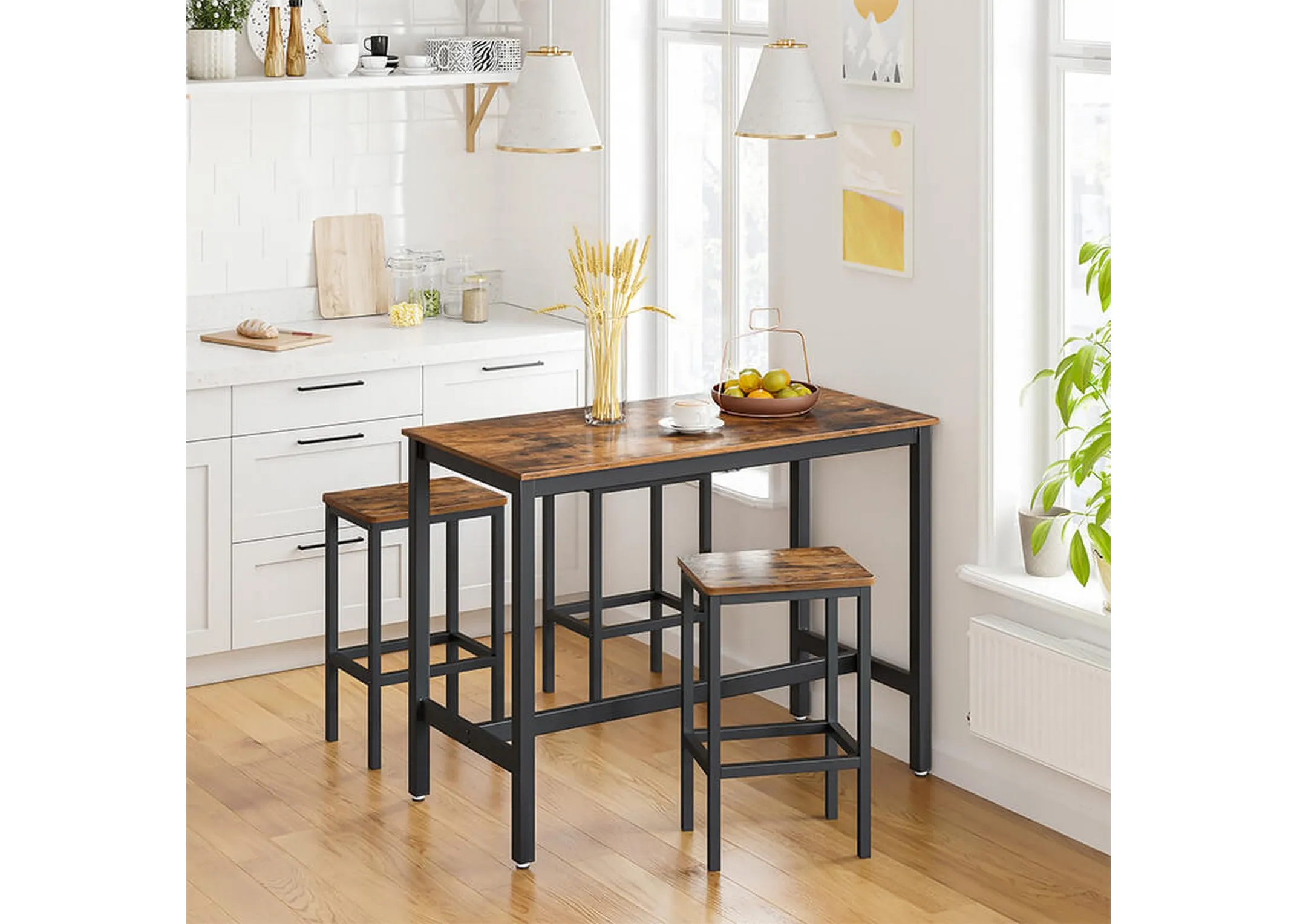 A lifestyle image of the Bourbon bar table with 2 bar stools in a kitchen setting