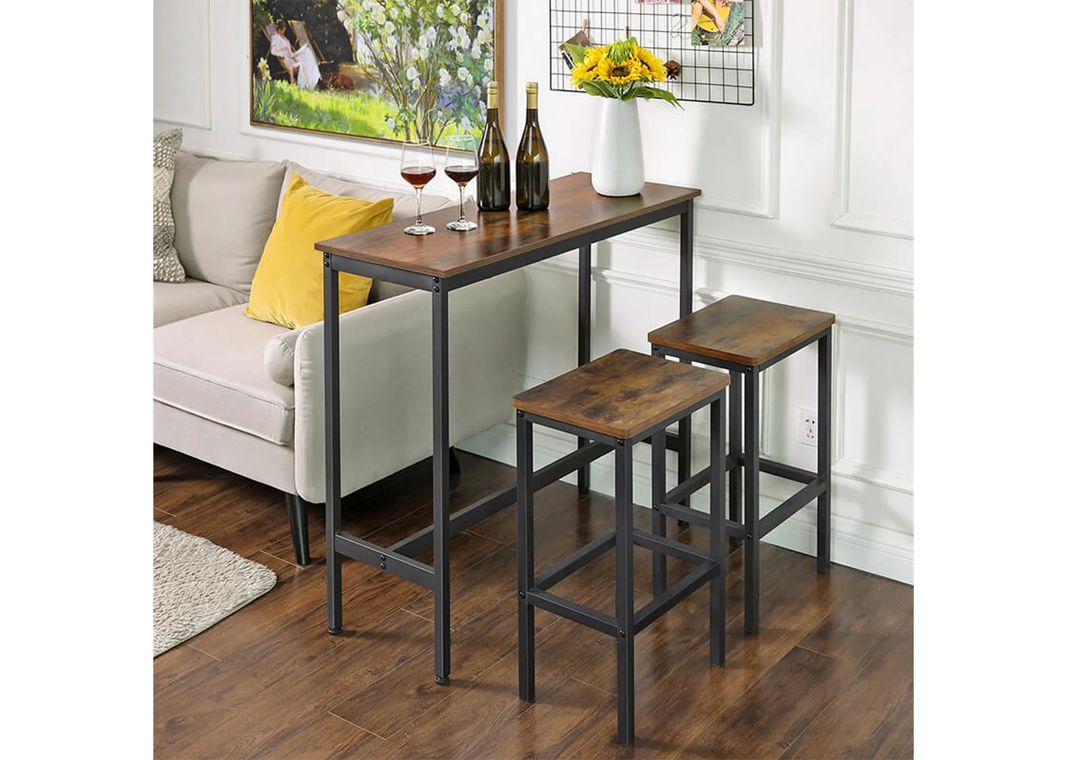 A lifestyle image of the Bourbon bar table in a living room with 2 bar stools