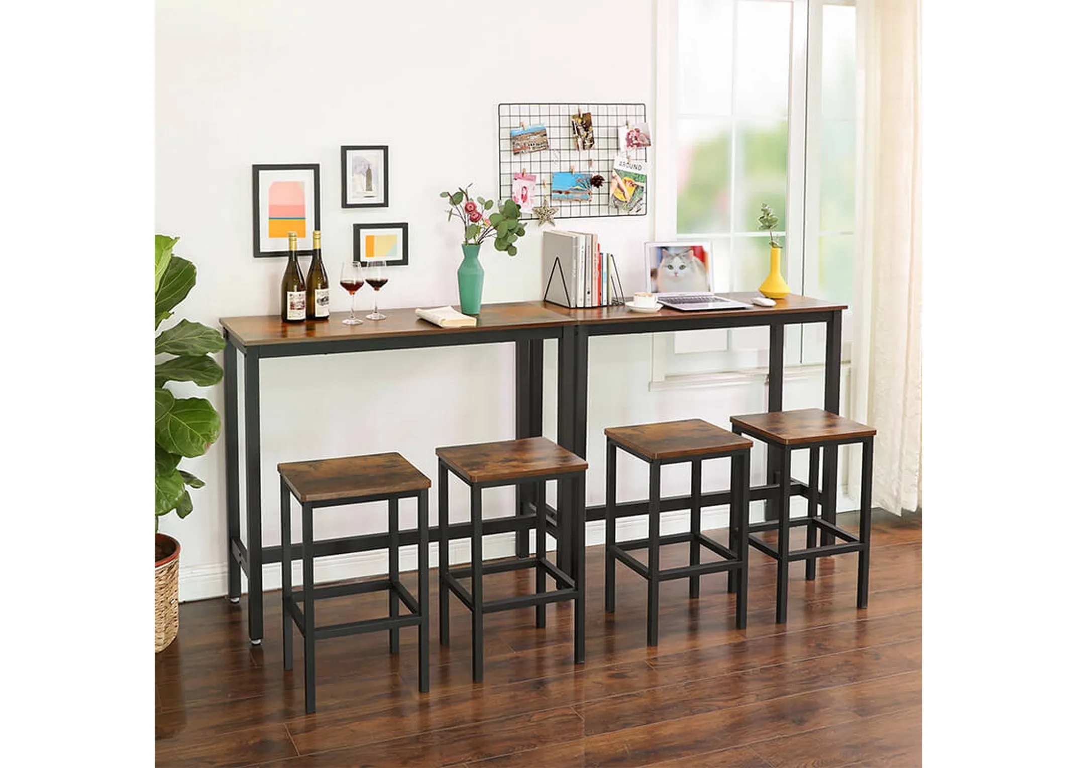 A lifestyle image of 2 Bourbon bar tables side by side against a wall in a home with 4 bar stools