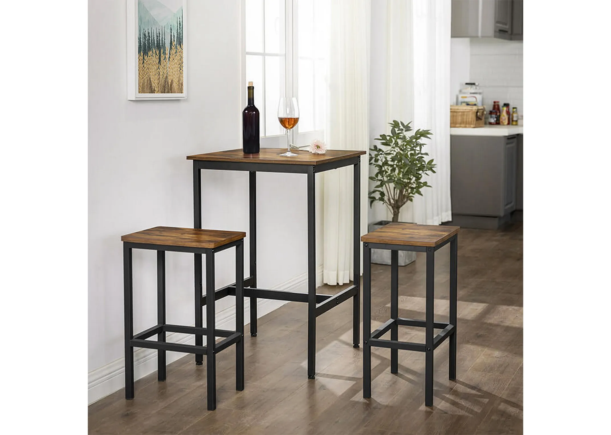 A lifestyle image of the square bar table with 2 bar stools in a kitchen setting with wine bottle and glass.