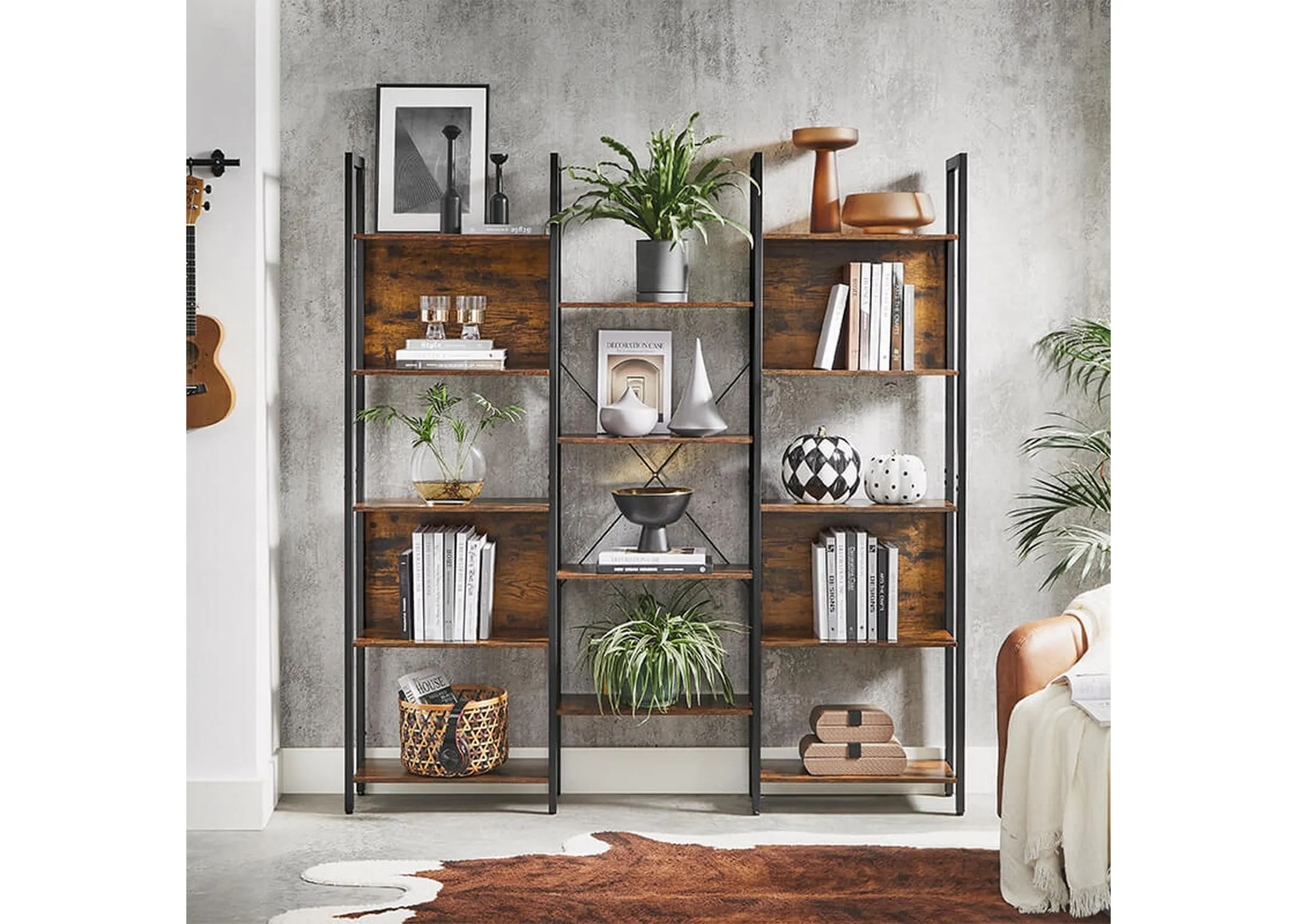 A lifestyle image of the Bourbon display unit with 4 storage wood shelves filled with books abd other shelves with ornaments and baskets.