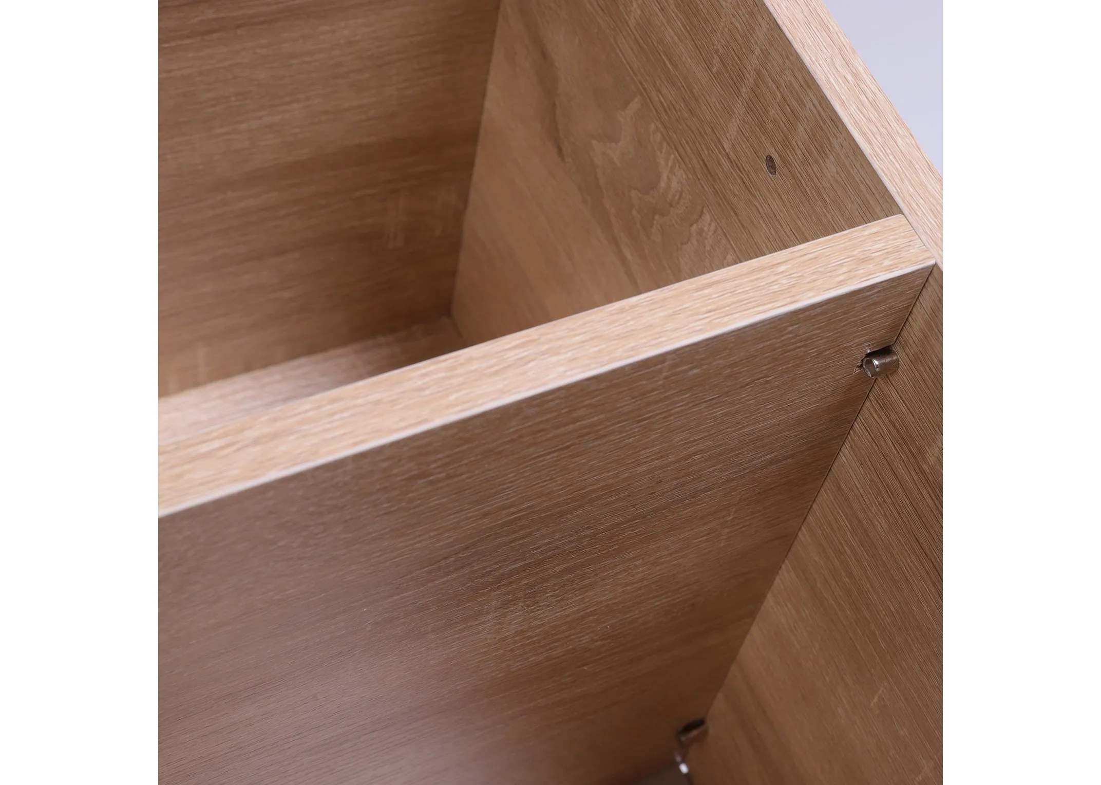 A wood storage bench with 10 compartments from EZ Livings Jojo range. Closeup view of velcro removeable cushions seat top