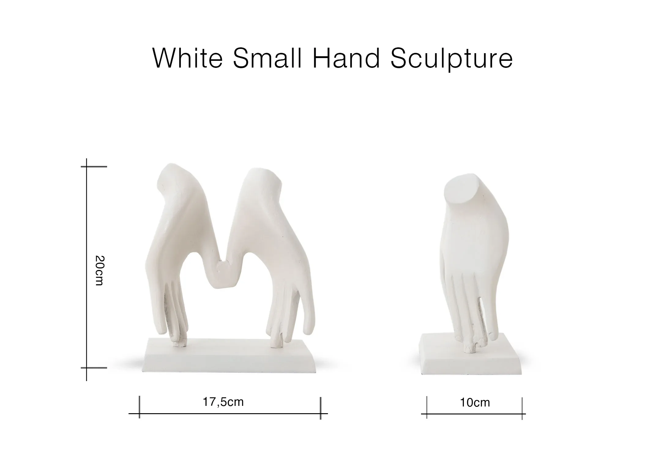 A lifestyle image of the Nola black dining table with cape chairs & small white hand sculpture