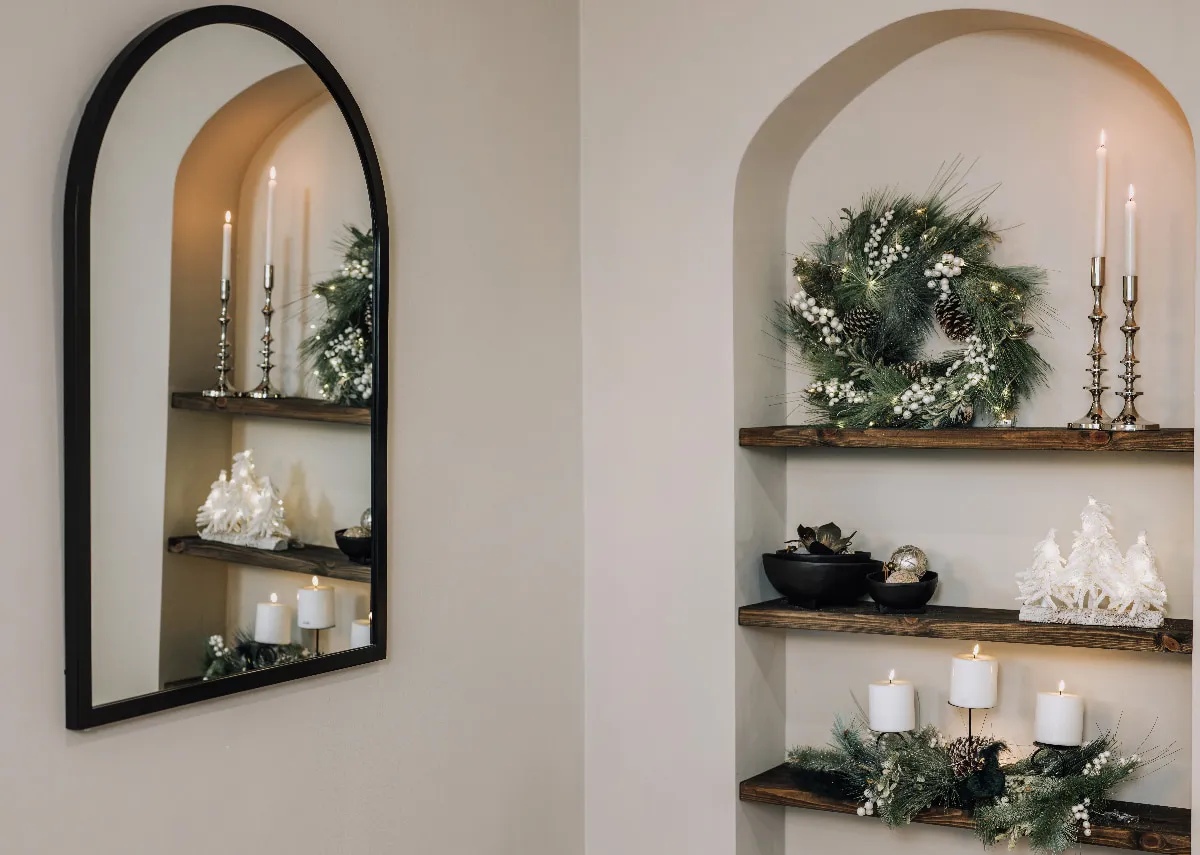 A lifestyle image of a sideboard with Pearl & Pine LED tree and Silver candlestick.