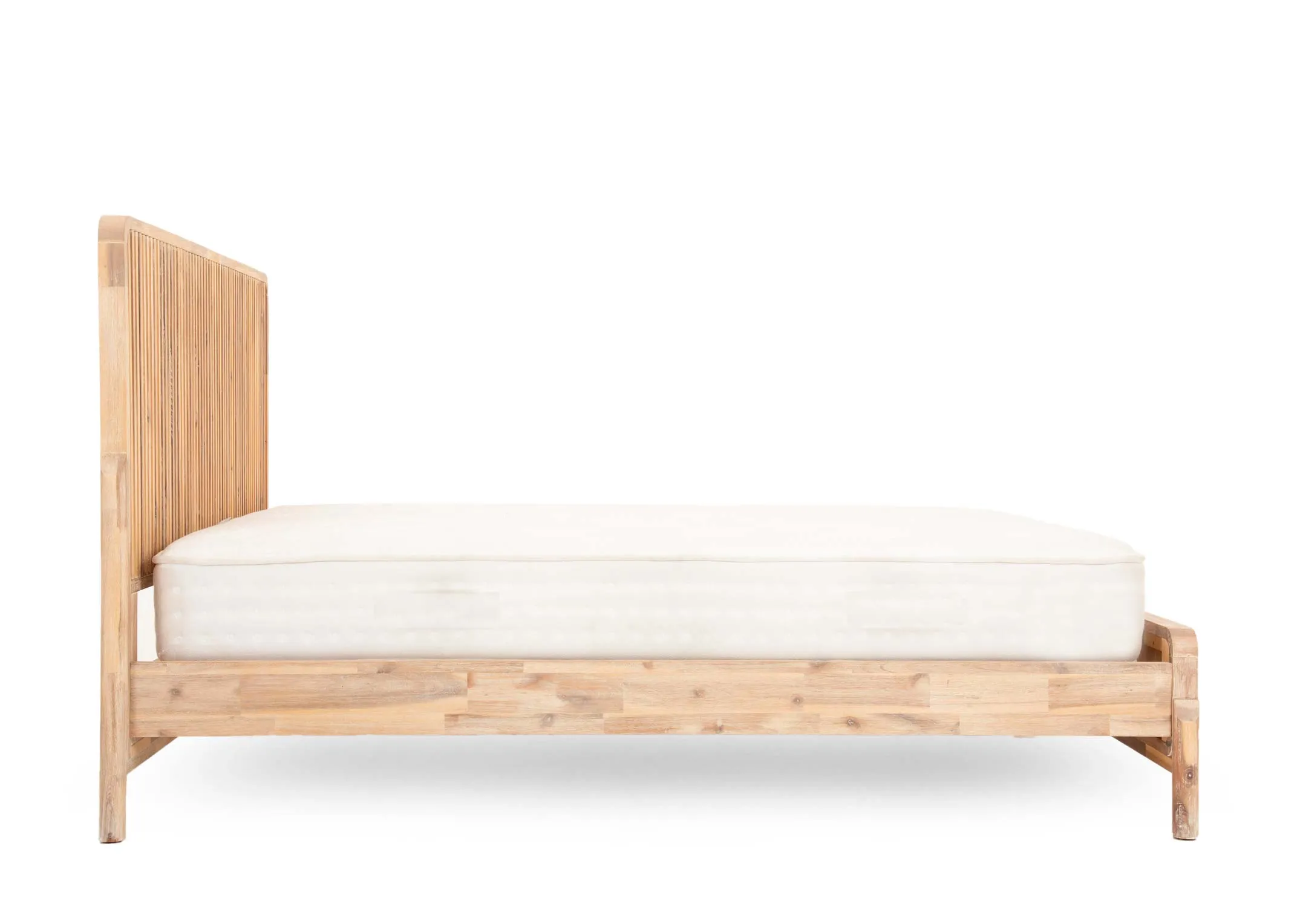 A 5ft acacia bedframe from EZ Livings Milo range. Closeup of distressed finish on footboard.