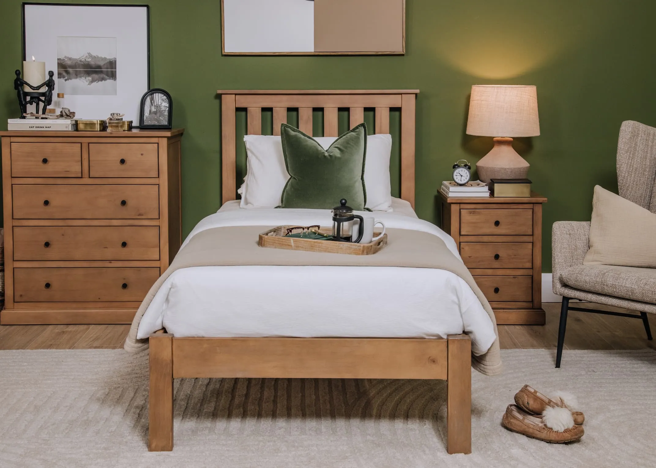 A lifestyle image of the Atlas Rustic Bed range with locker & tallboy with Boston chair & Mai Table lamp.