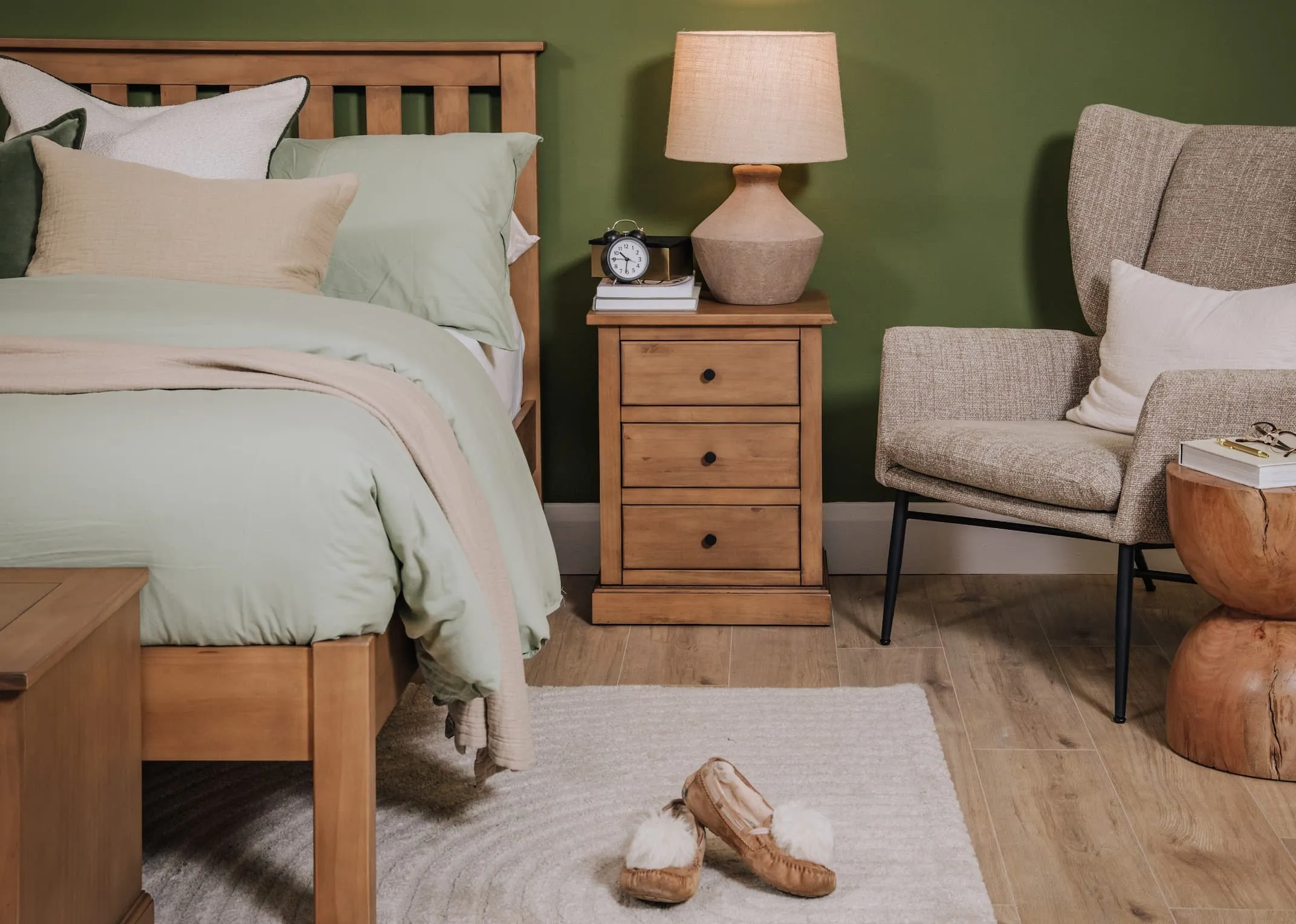 A lifestyle image of the Atlas rustic locker with mai table lamp.
