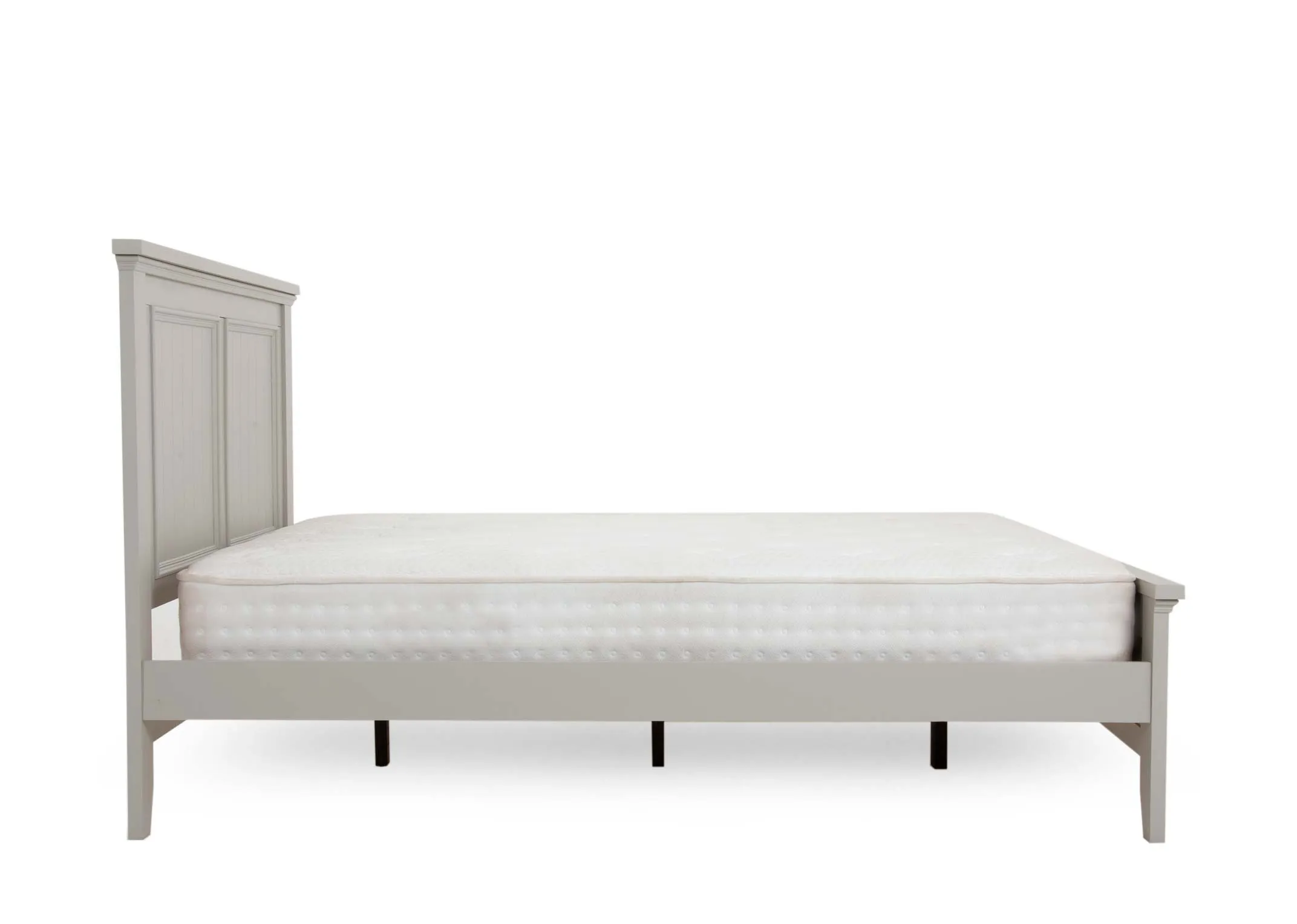 A light grey painted 5ft bedframe with pannelled head and footboard from EZ Livings Joseph range. Side view of tapered legs