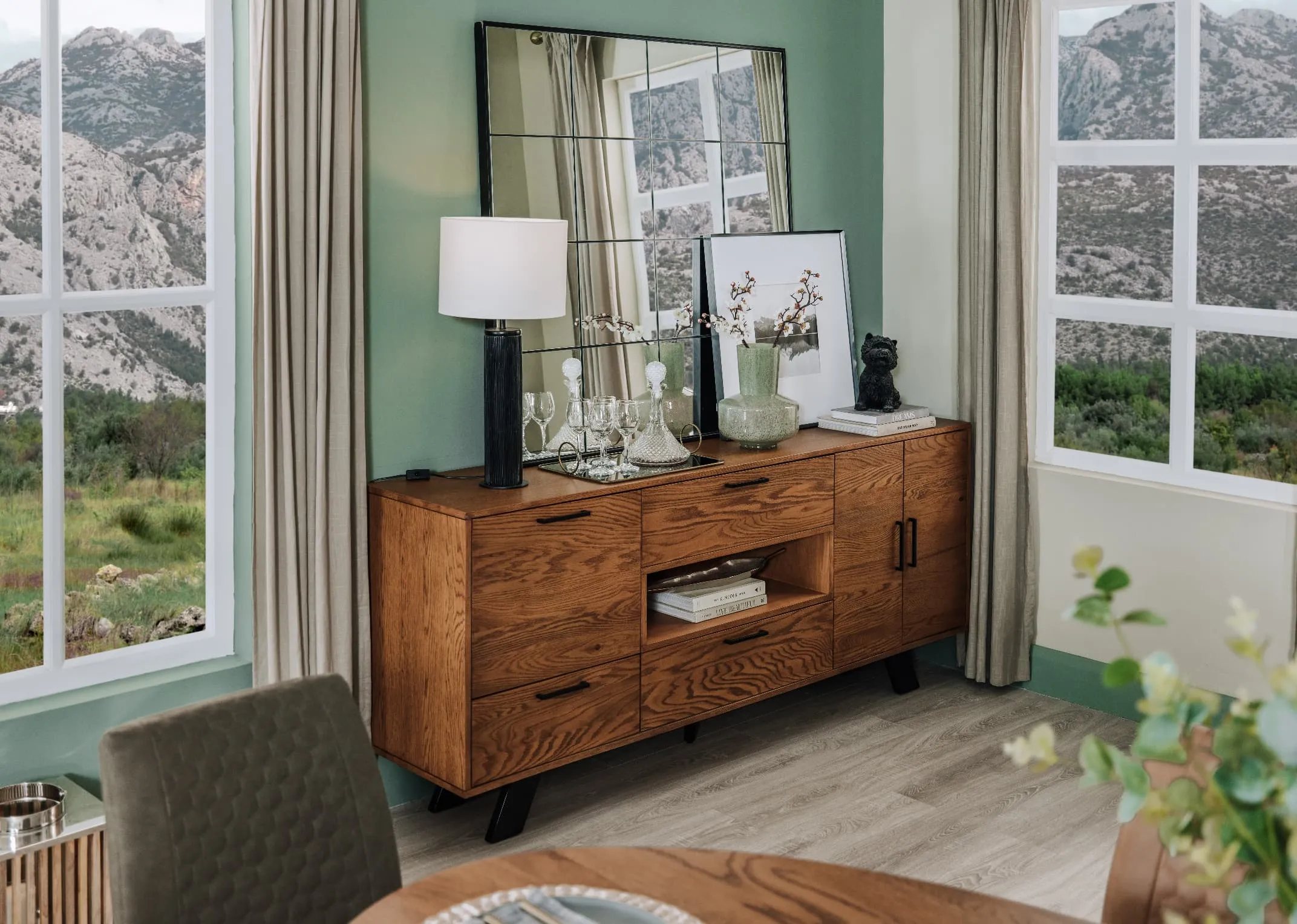A lifestyle image of the Oslo sideboard with Lohas lamp and Farley mirror