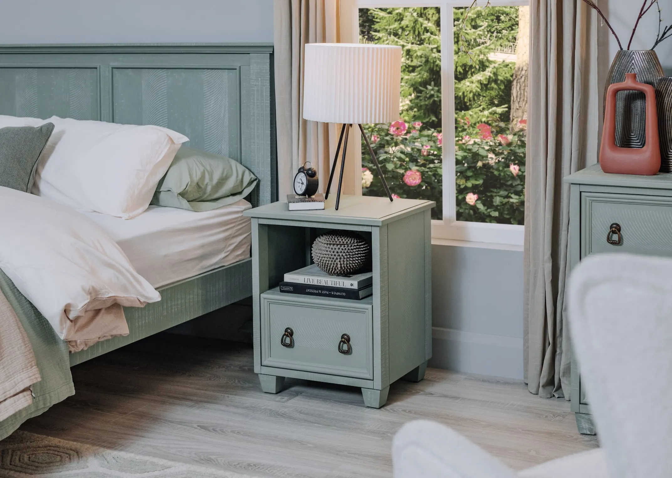 A lifestyle image of the Grenoble locker with metal table lamp on and matching bedframe & chest.