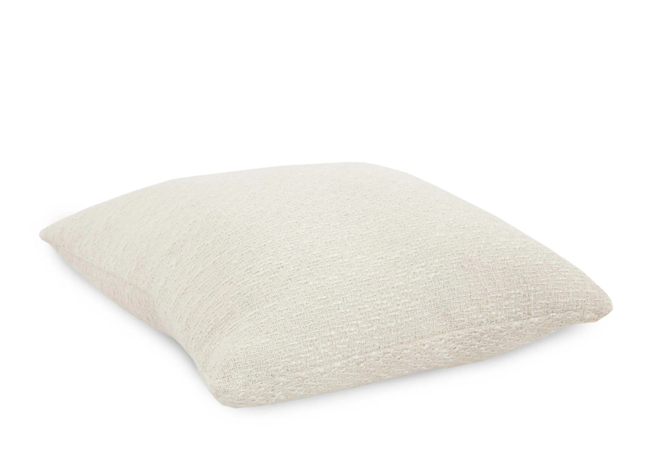 A cream knitted cushion from EZ Livings Cushion range. Angled view
