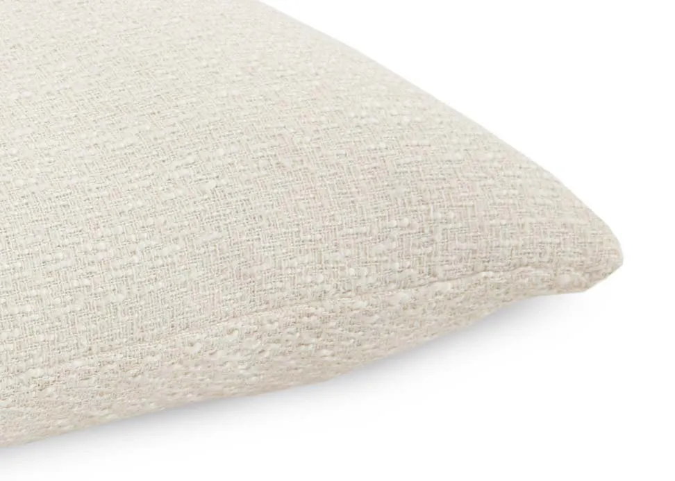 A cream knitted cushion from EZ Livings Cushion range. Closeup of fabric.