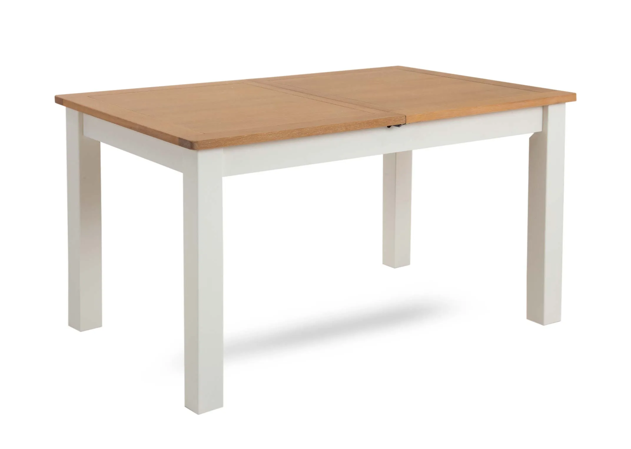 A white dining table with oak table top from EZ Livings Barleycove range. Angled view of white legs.