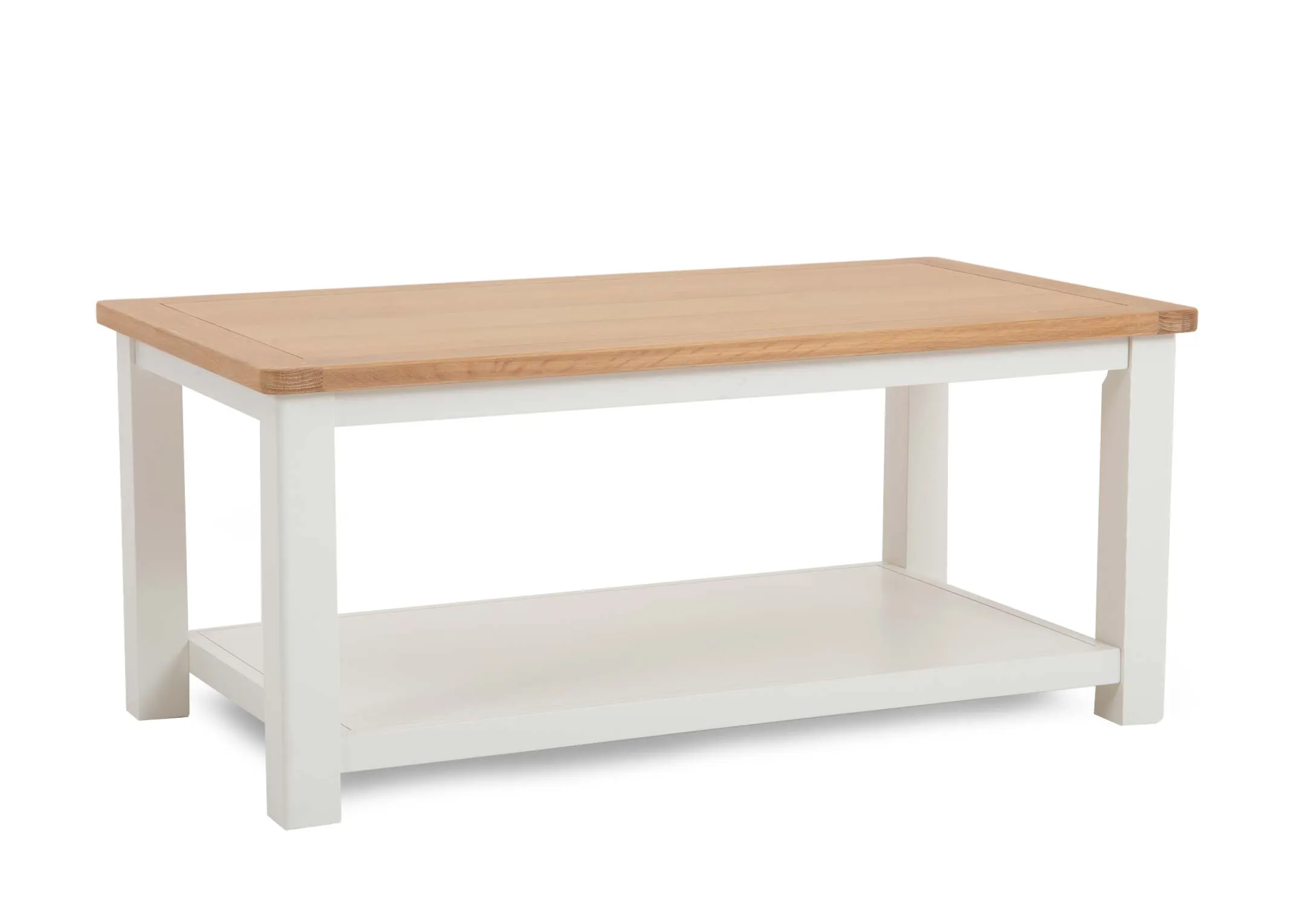 A white coffee table with oak top from EZ Livings Barleycove range. Angled view of the large lower shelf space.