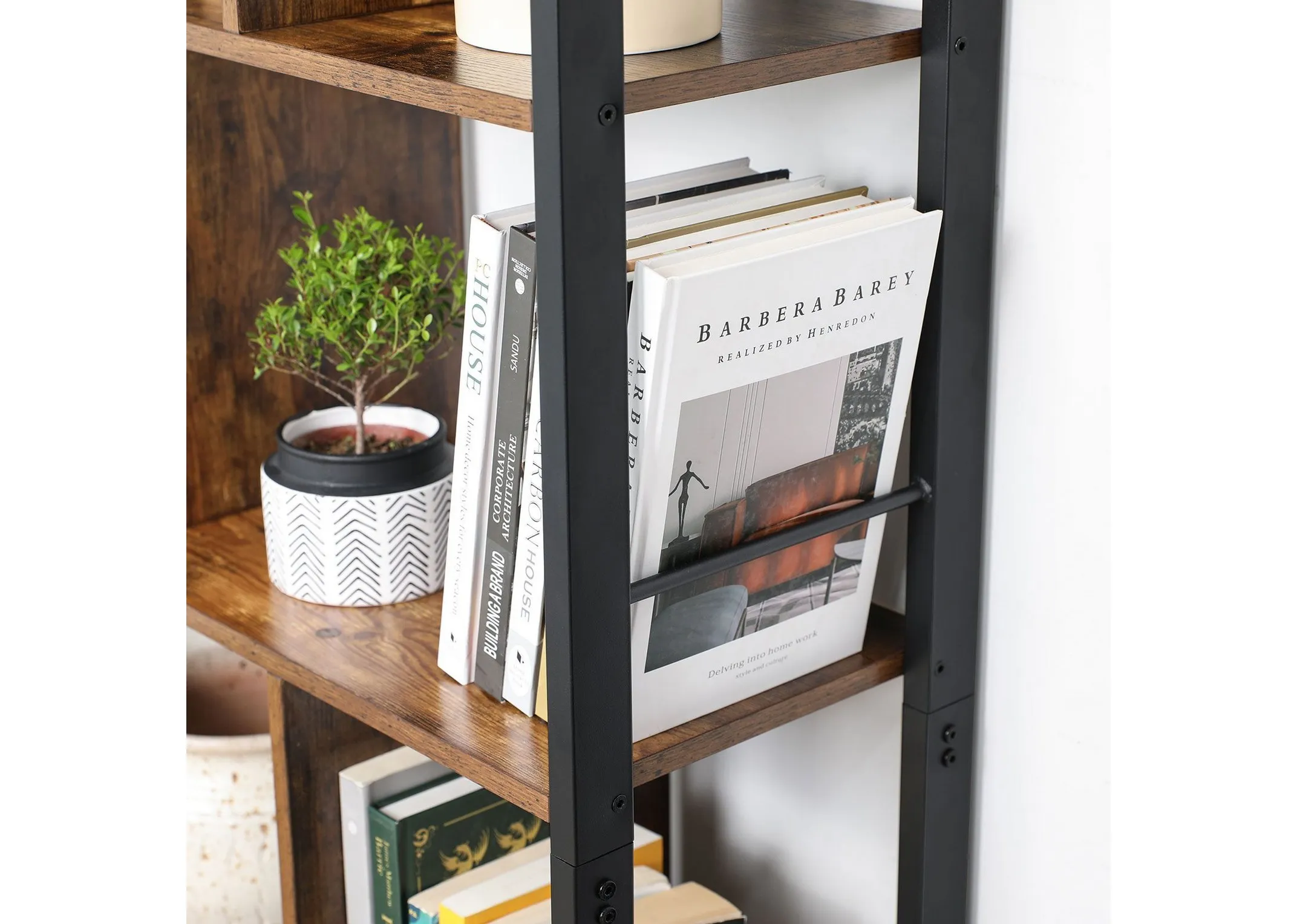 A lifestyle image of the Jools display cabinet with closeup of rustic wood shelf with plants and books.