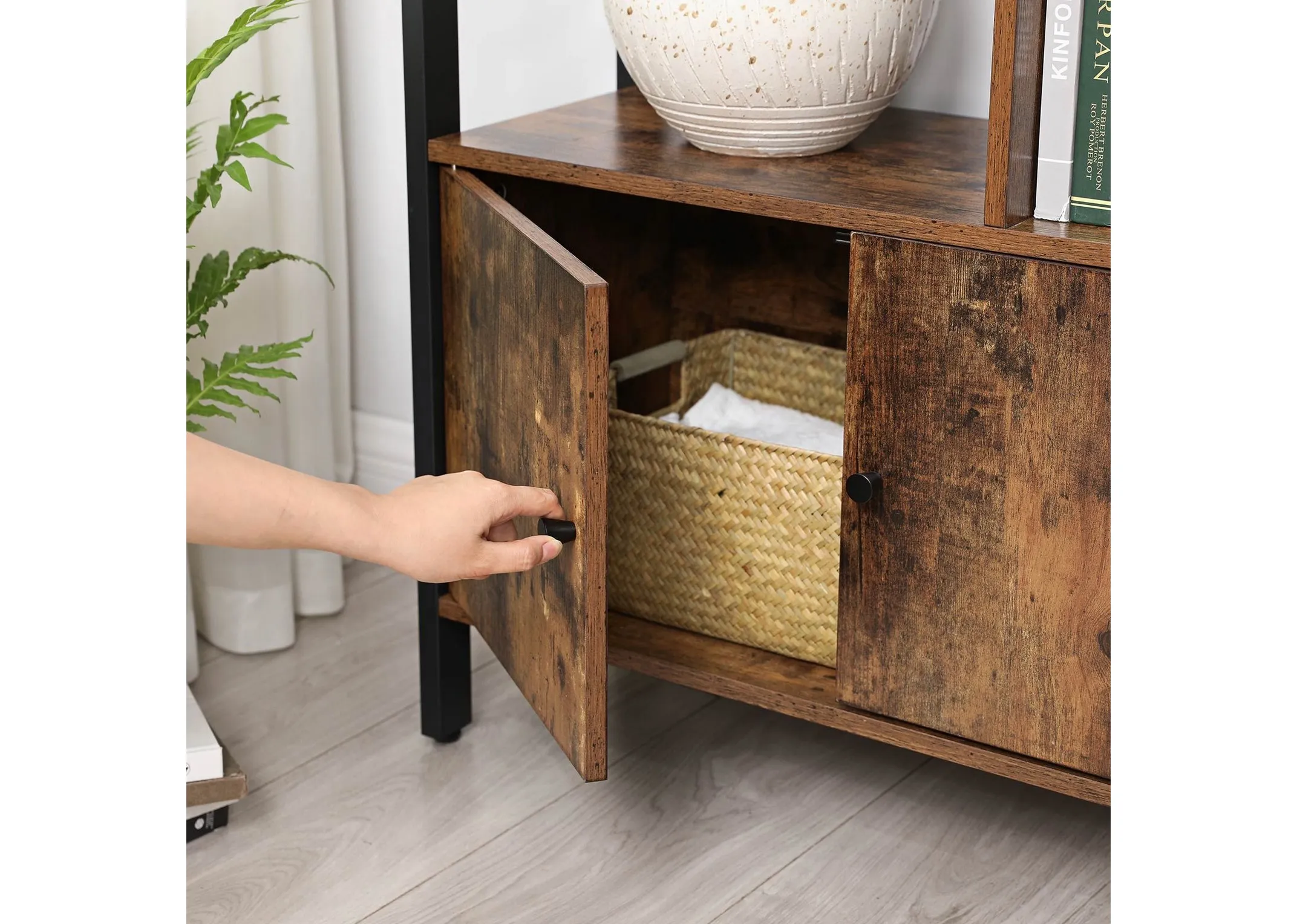 A lifestyle image of the Jools display cabinet with closeup of rustic wood doors to storage cabinets