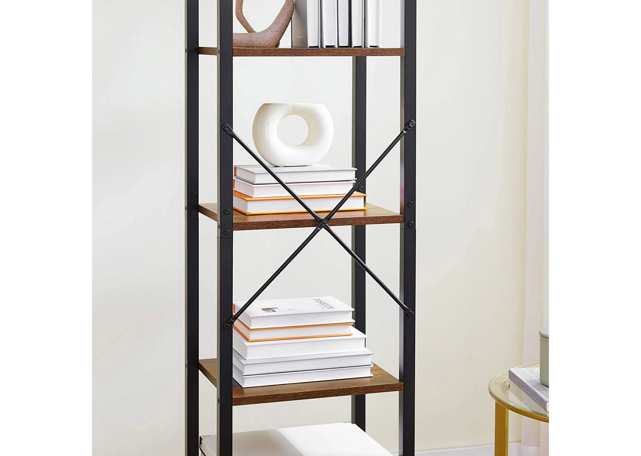 A lifestyle image of the Specter Slim bookcase with a closeup of books and ornaments