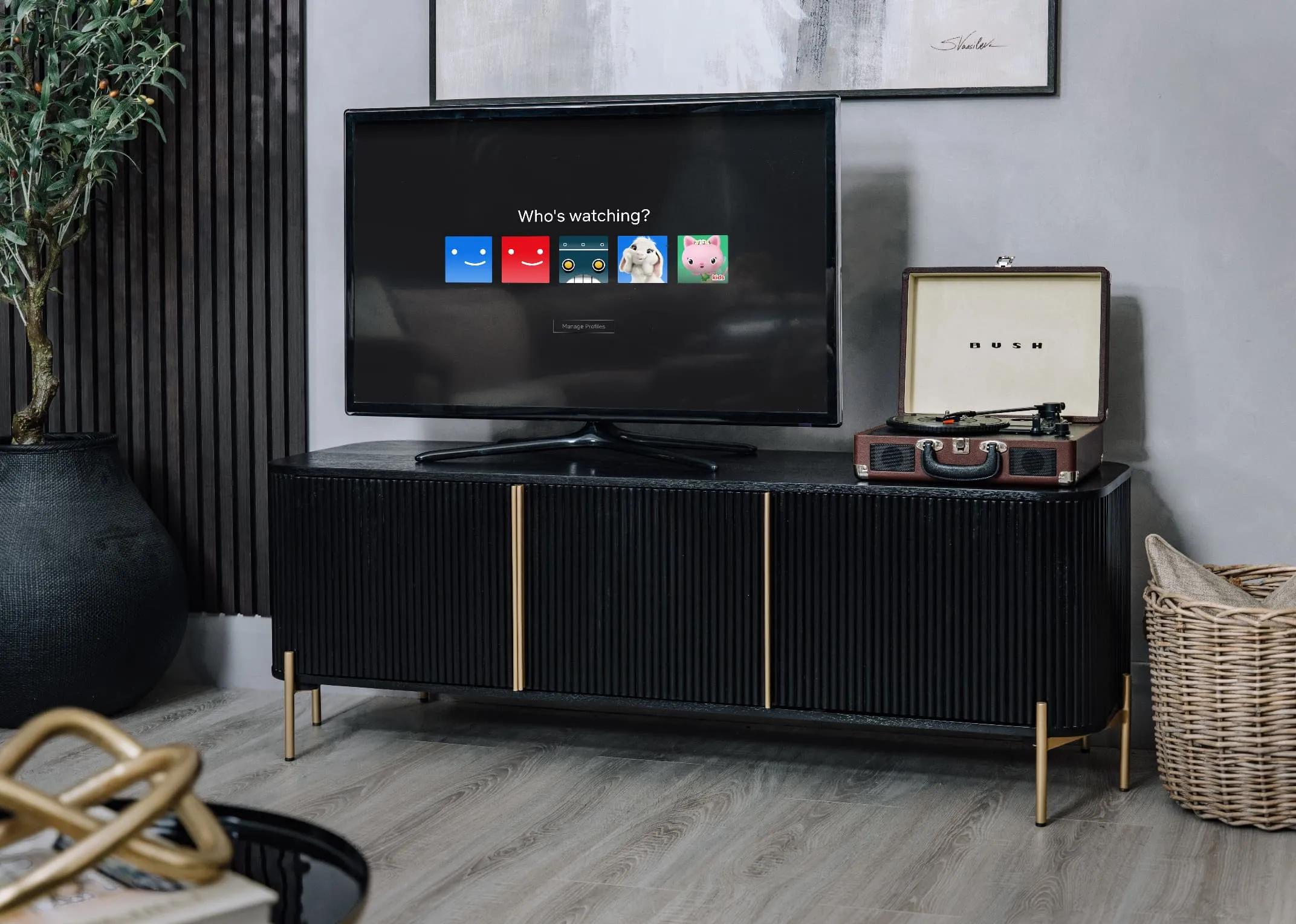 A lifestyle image of the Rego TV Unit with flat screen tv and record player on top.