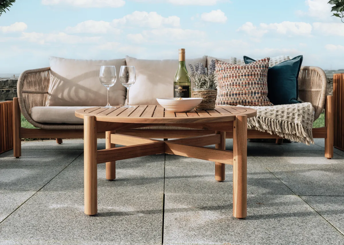 A garden set with a 3 seater sofa with acacia wood frame from EZ Livings La Palma range. Back view of wicker style supportive frame.