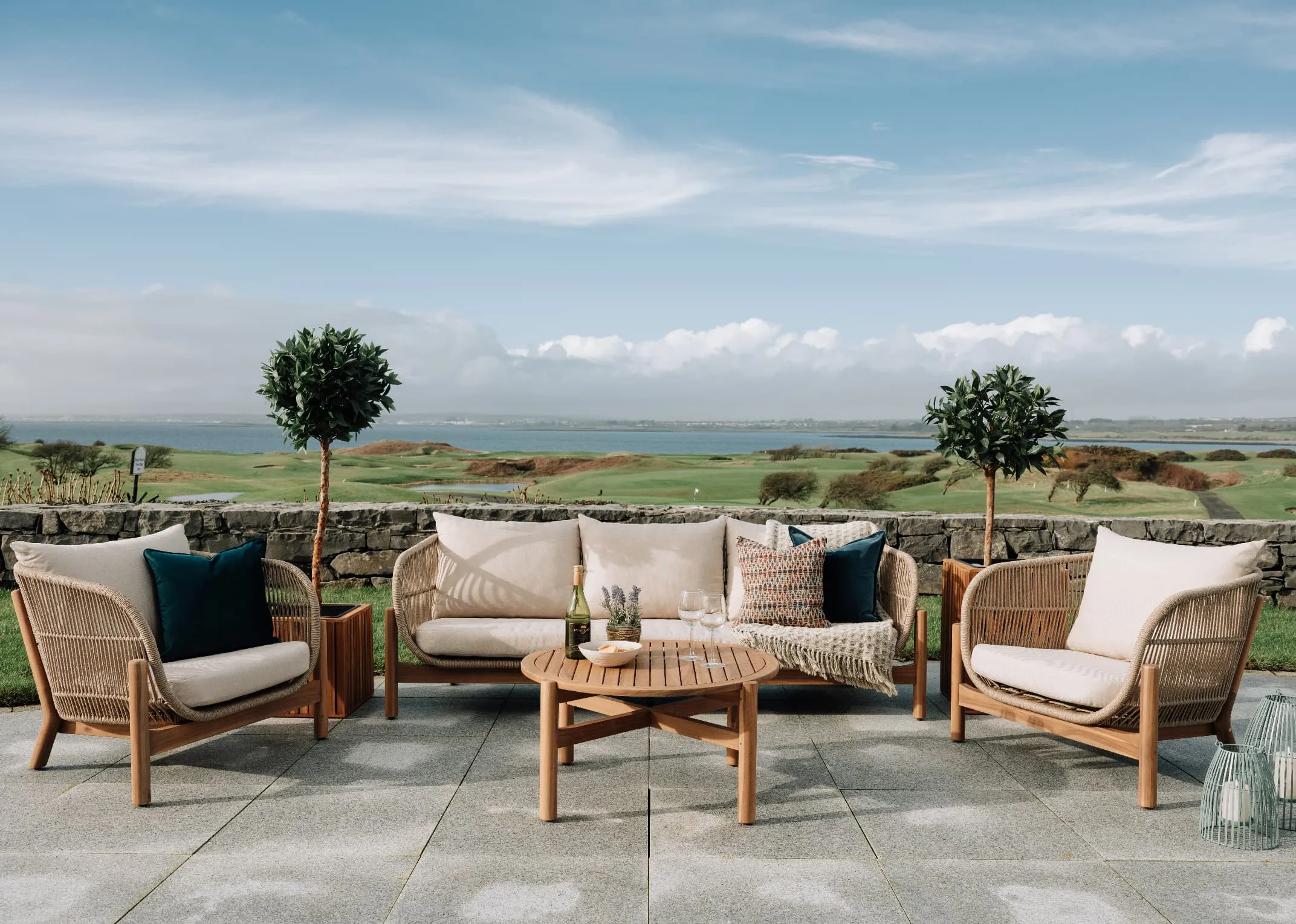 A lifestyle image of the La Palma Garden set with 3 seater 2 armchairs and coffee table on a verandah setting.