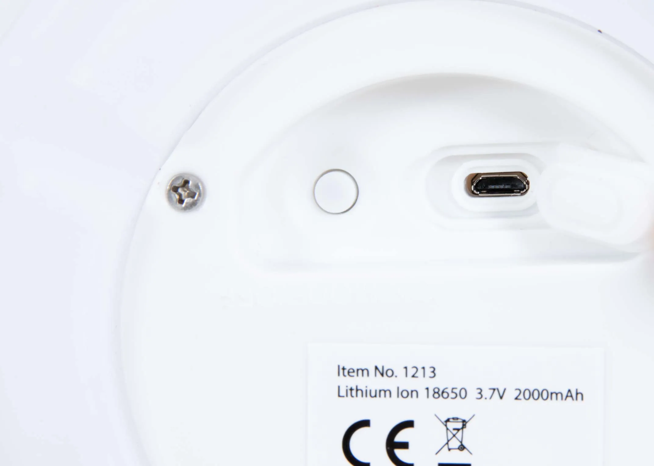 An outdoor white table lamp from EZ Livings Altair range. Closeup of battery charger