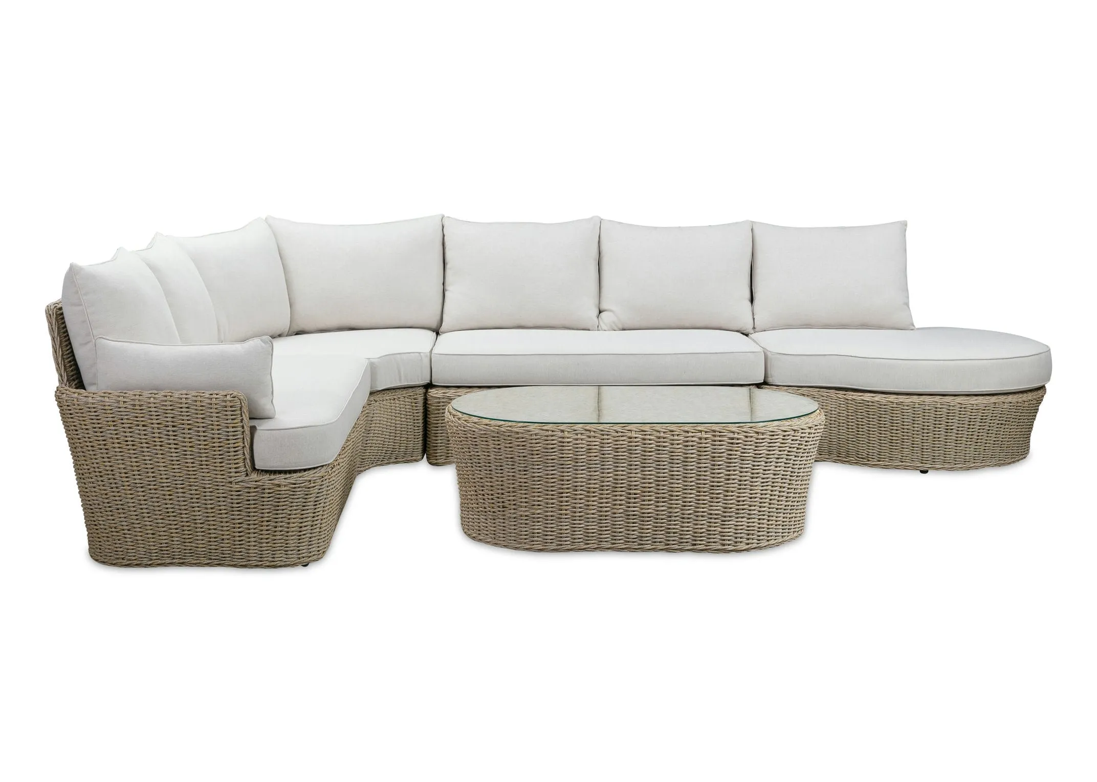 A white corner sofa with wicker base from EZ Livings Saint Tropez range. Front view of sofa with table.