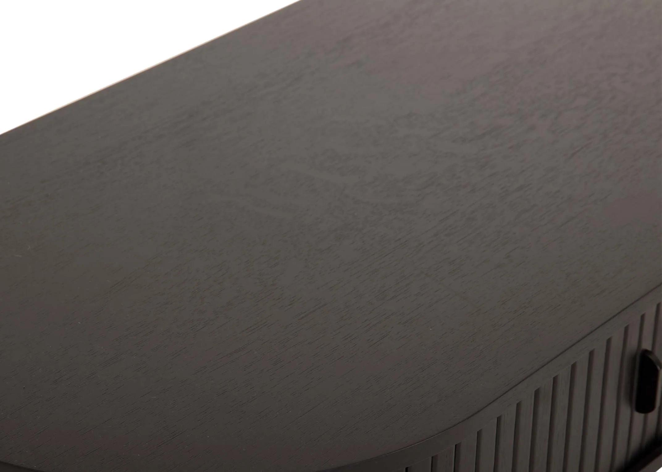 A black oak coffee table with a slatted tambour door from EZ Livings Nola range. Clsoeup of textrued finish top