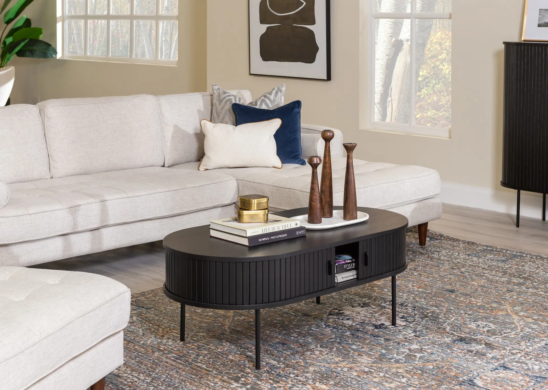 A lifestyle image of the Nola Coffee table with Genoa corner sofa and Maxima rug