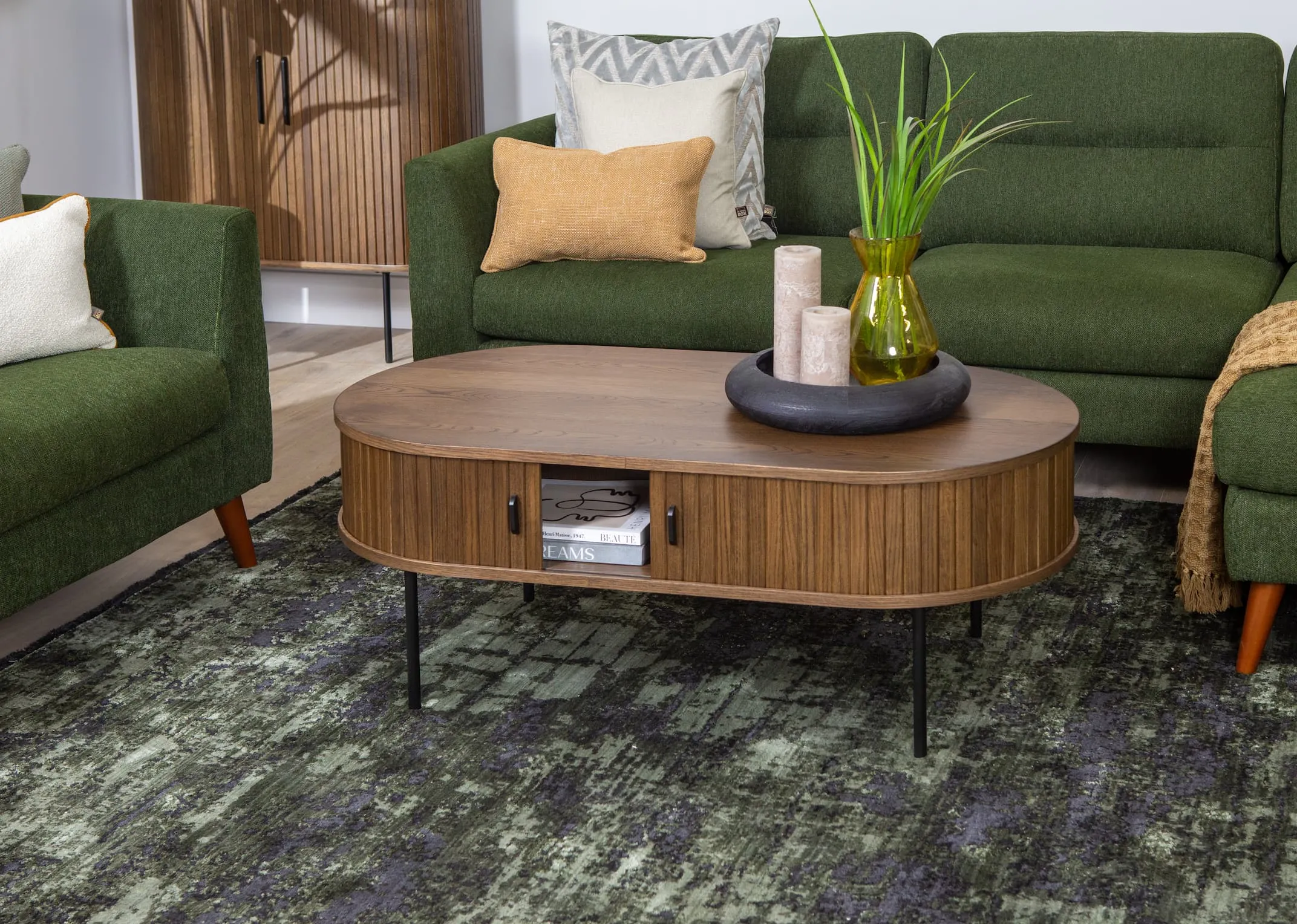 A smoked oak tambour door coffee table from EZ Livings Nola range. Closeup of slatted front with metal handles