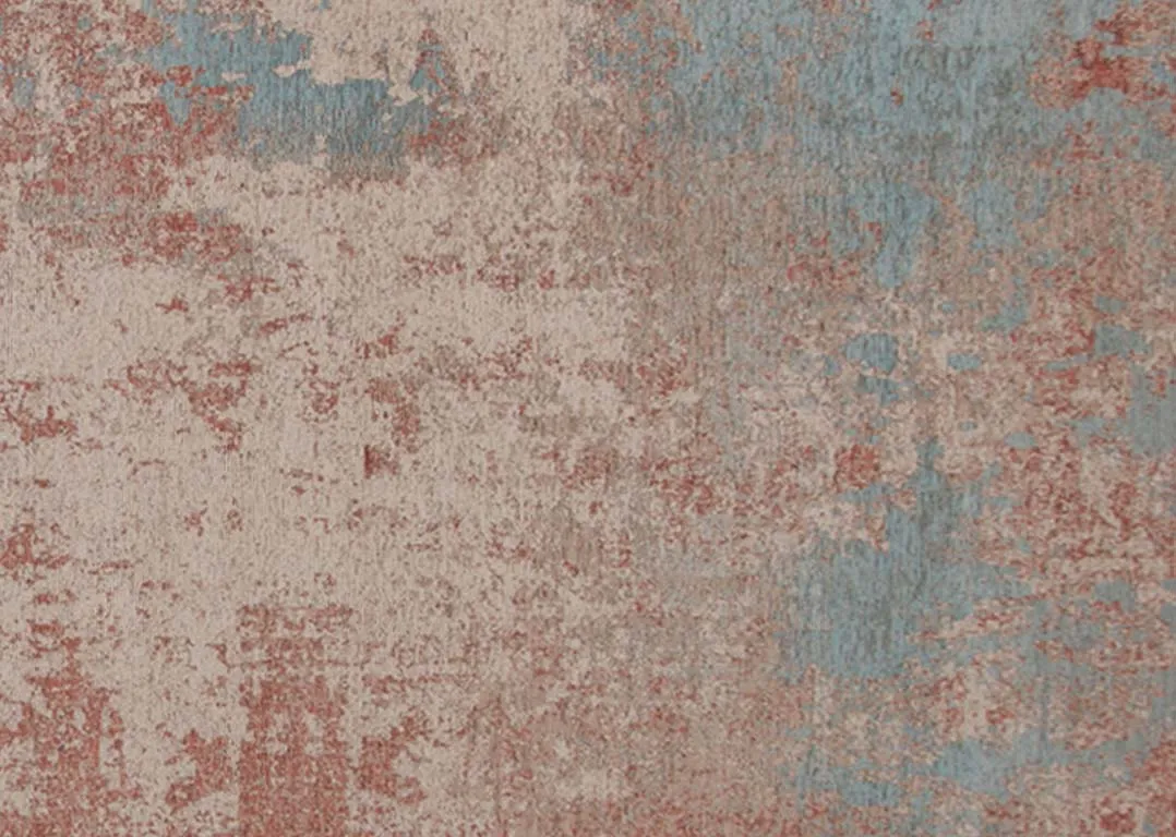 A dark pink and grey ombre rug from EZ Livings Chloe range. Closeup of grey and cream splotches.