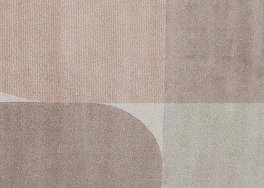 A beige brown grey and orange geo shaped rug from EZ Livings Divine range. Closeup of shapes and color