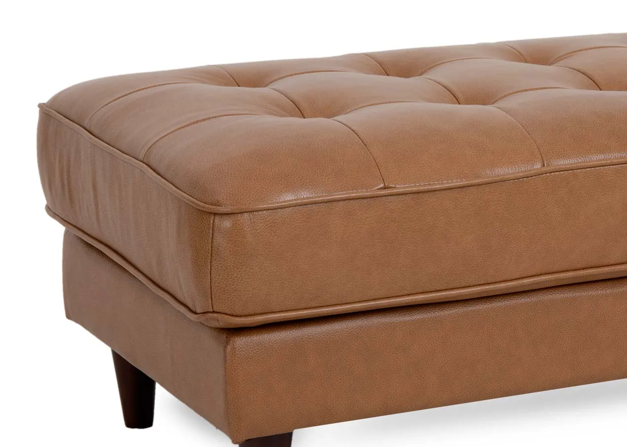 A rectangular tan leather footstool from EZ Livings Genoa range. Closeup of tufted button detail on top