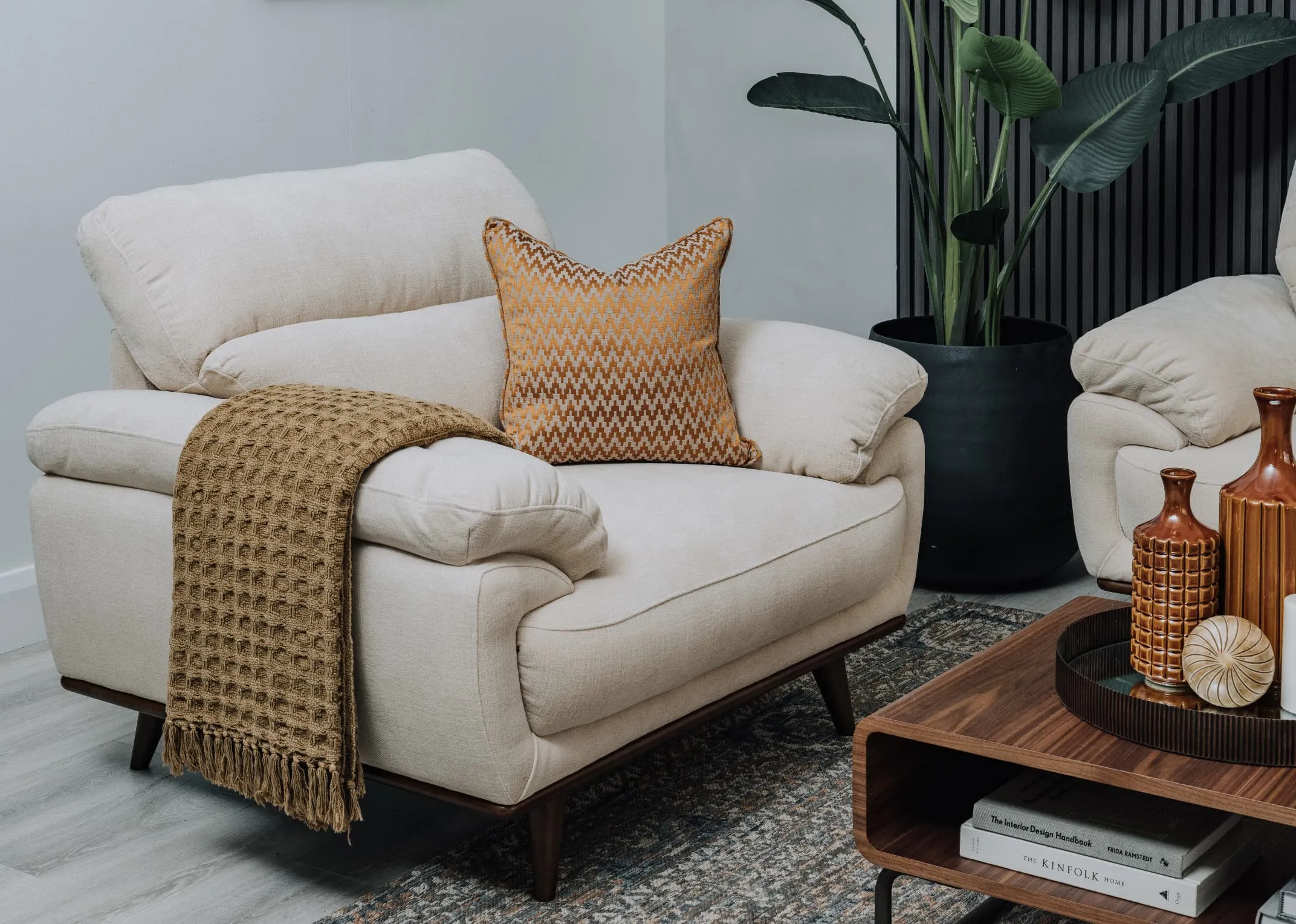 A lifestyle image of the Pippa armchair with the Uptown coffee table.