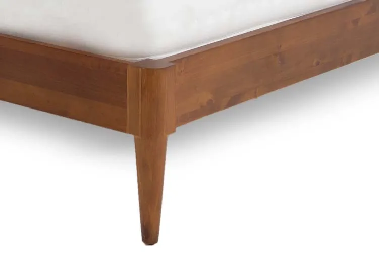 A double 4ft dark wood bedframe from EZ Livings Leya range. Closeup of tapered leg