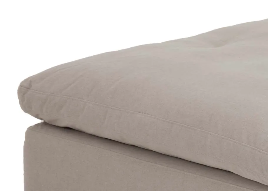 A very large grey fabric footstool from EZ Livings Cozy range. Closeup of soft cushion seat