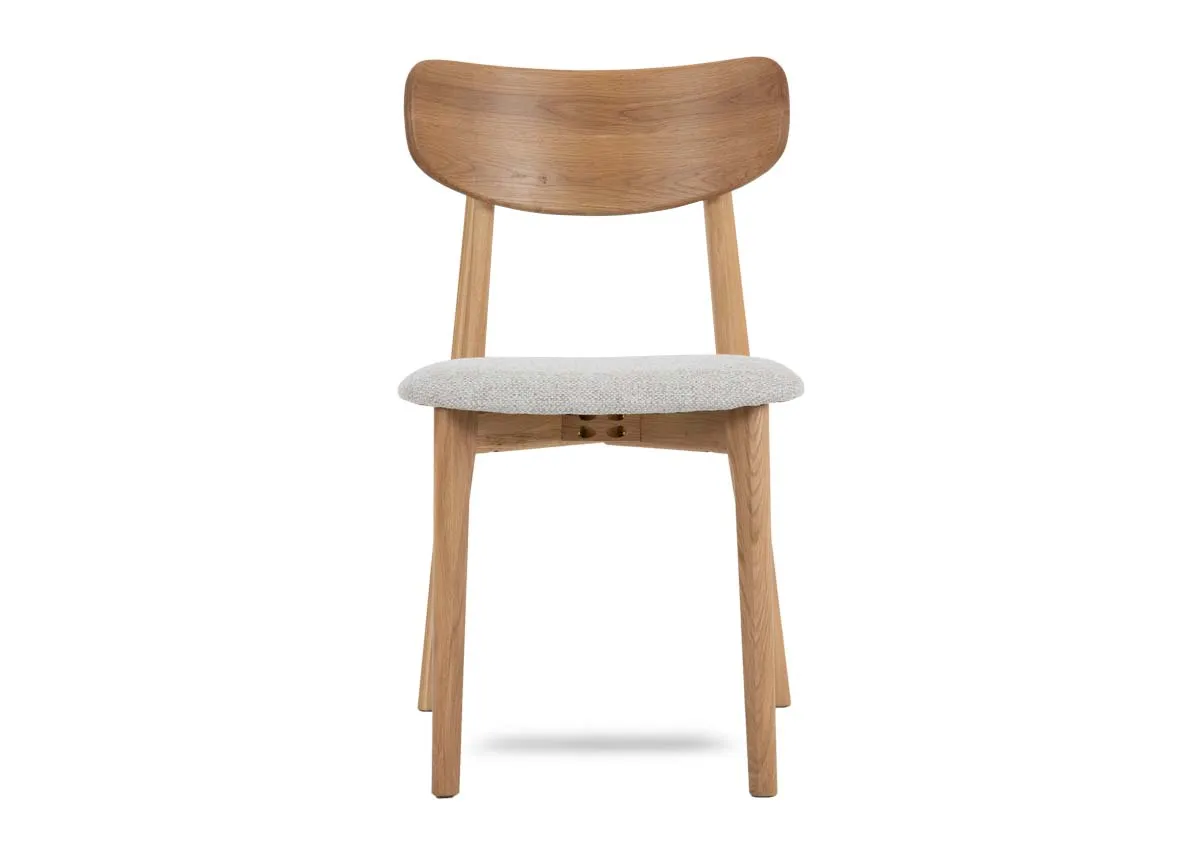An oak dining chair with cream fabric seat from EZ Livings Bari range.Front view of padded seat.