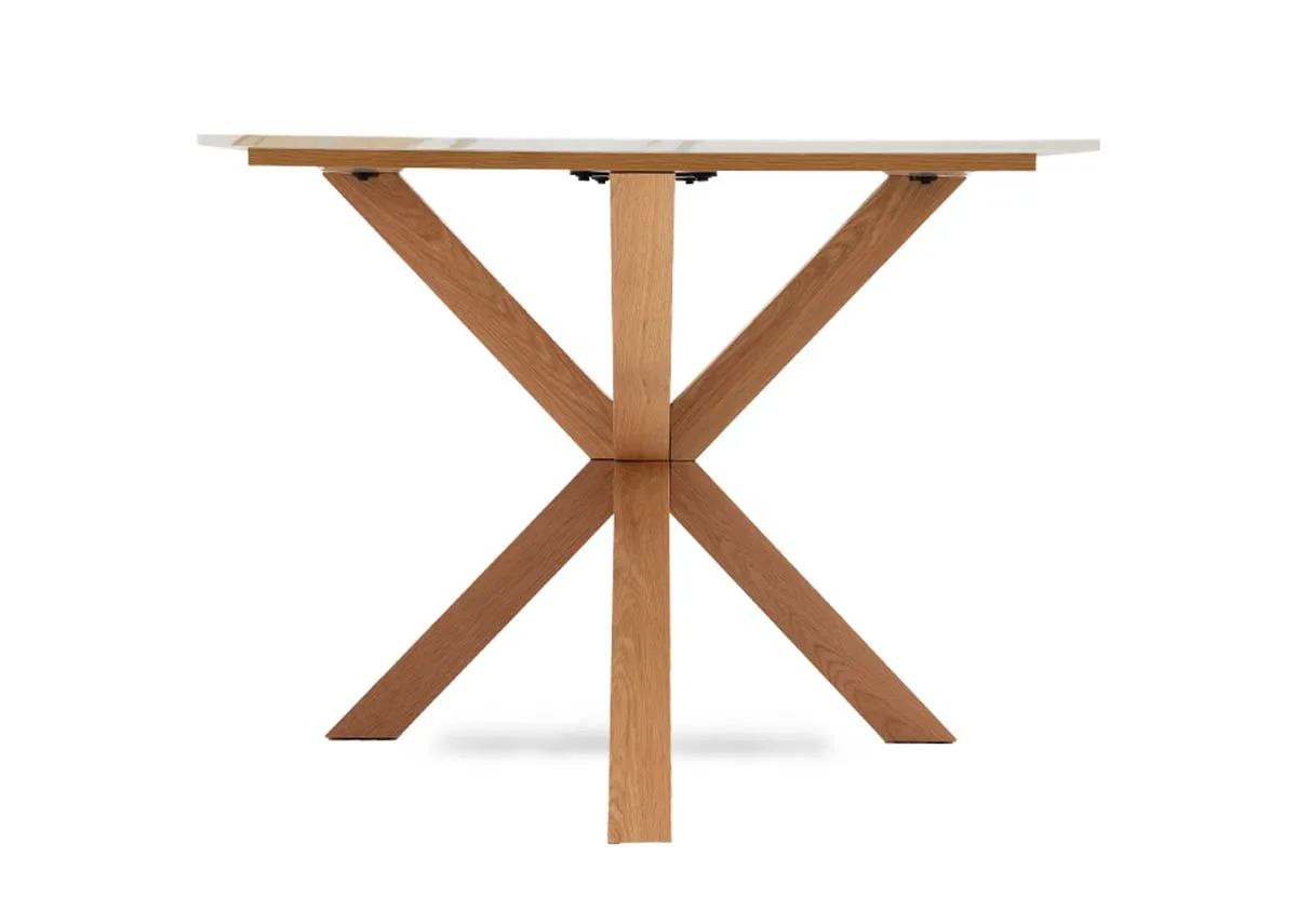 A rectangular melamine top dining tabel with oak legs from EZ Livings Ravello range. Closeup of melamine top