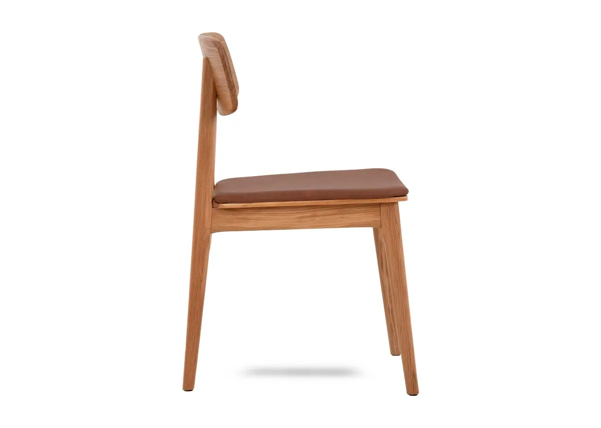 An oak framed dining chair with tan pu seat from EZ Livings Ravello range. Side view