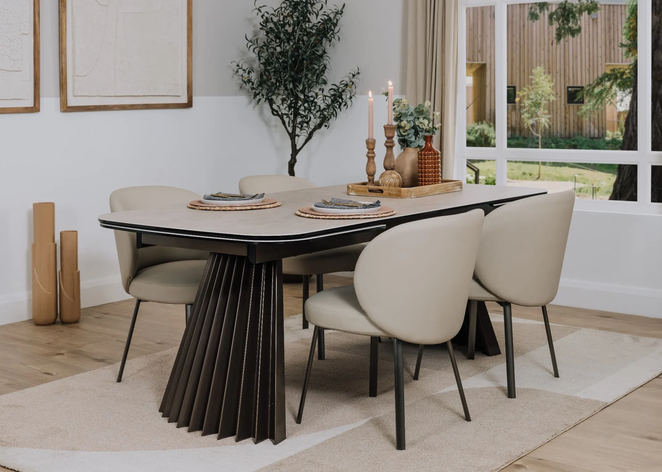 A lifestyle image of the Fulton dining table fixed with Lorenzo chairs and Creation rug.