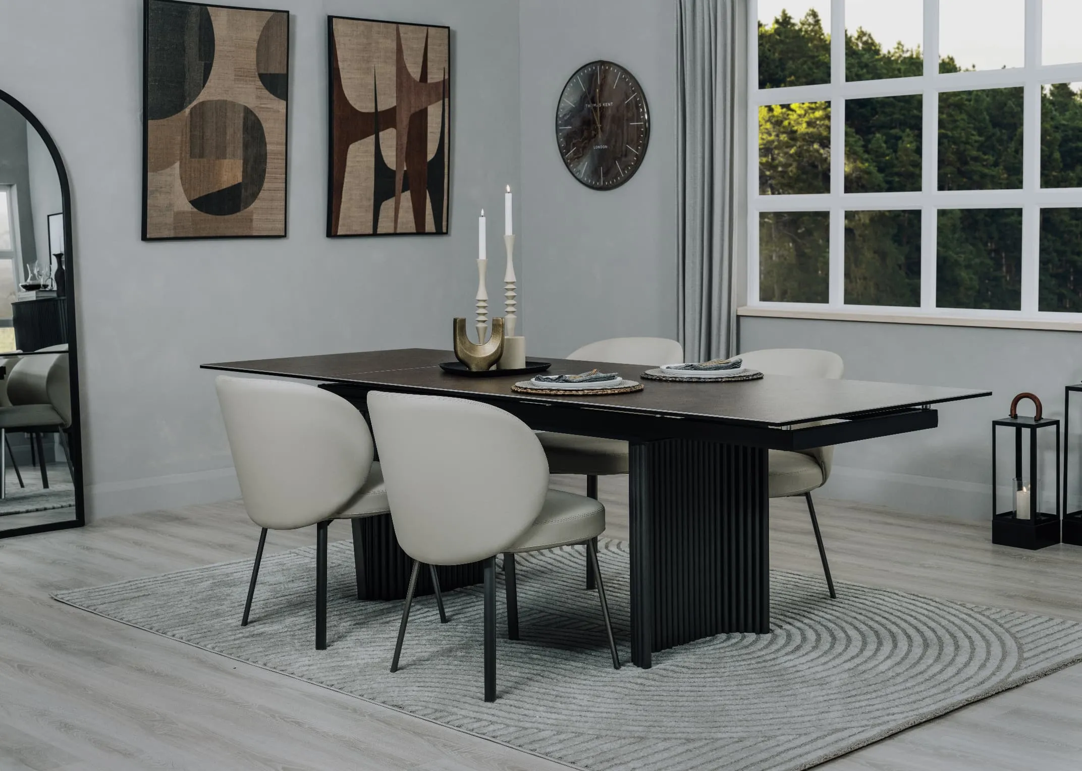 A lifestyle image of the Eton dining table with Lorenzo chairs with table and Eli rug.