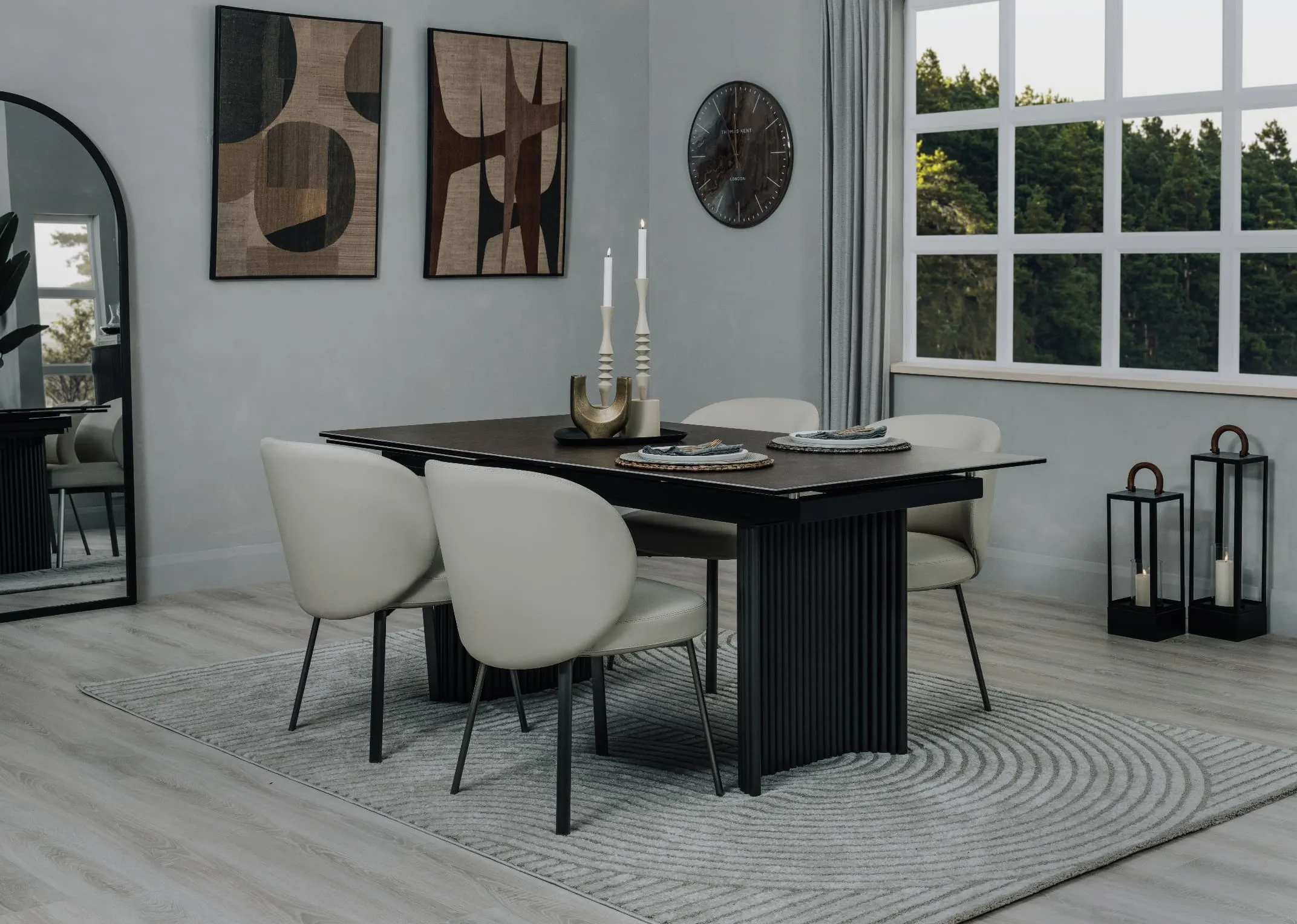 A lifestyle image of the Eton dining table with Lorenzo chairs with table and Eli rug.