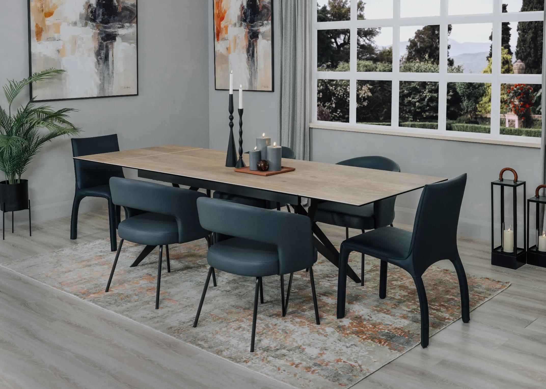 A lifetsyle image of the Kingston dining table extended with Matteo chair and rocco chairs from EZ Living on Modesto rug.
