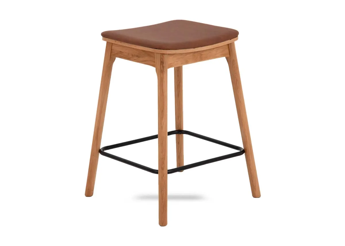 An oak bar stool with tan faux leather seat from EZ Livings Ravello range. Angled view