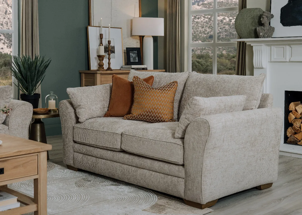 A lifestyle image of the Skyline 2 seater sofa with rust & maxene cushions with Albany coffee table.